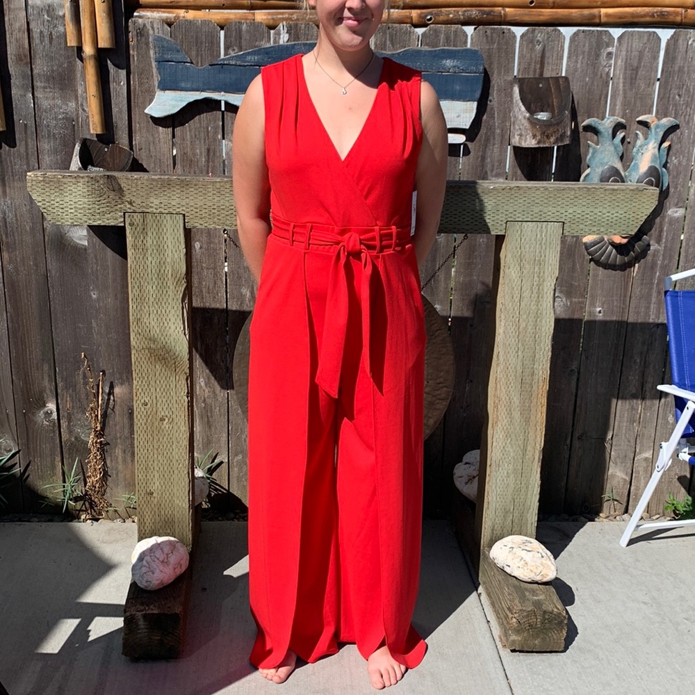 New with tags awesome red jumpsuit.